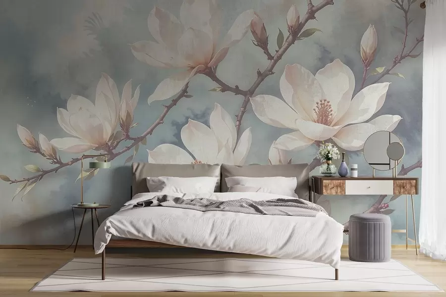 Fotobehang Witte magnolia bloemen bloeiend op boomtakken tegen een zachte, onscherpe blauwe achtergrond w08383