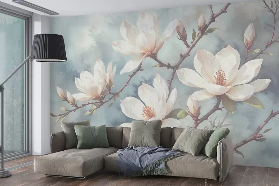 Fotobehang Witte magnolia bloemen bloeiend op boomtakken tegen een zachte, onscherpe blauwe achtergrond w08383