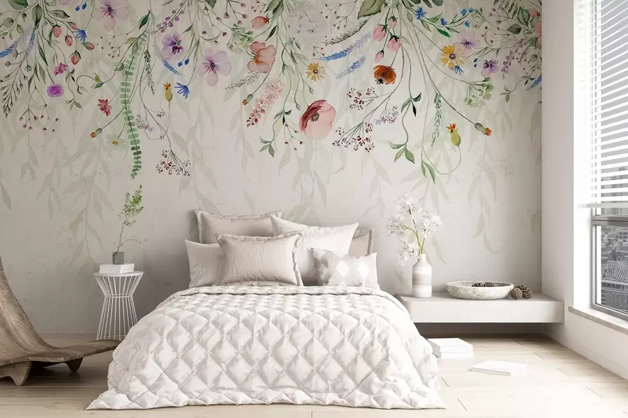 Papier peint photo Un imprimé floral coloré qui tombe en cascade avec diverses fleurs, feuilles et plantes dans un style aquarelle w08646