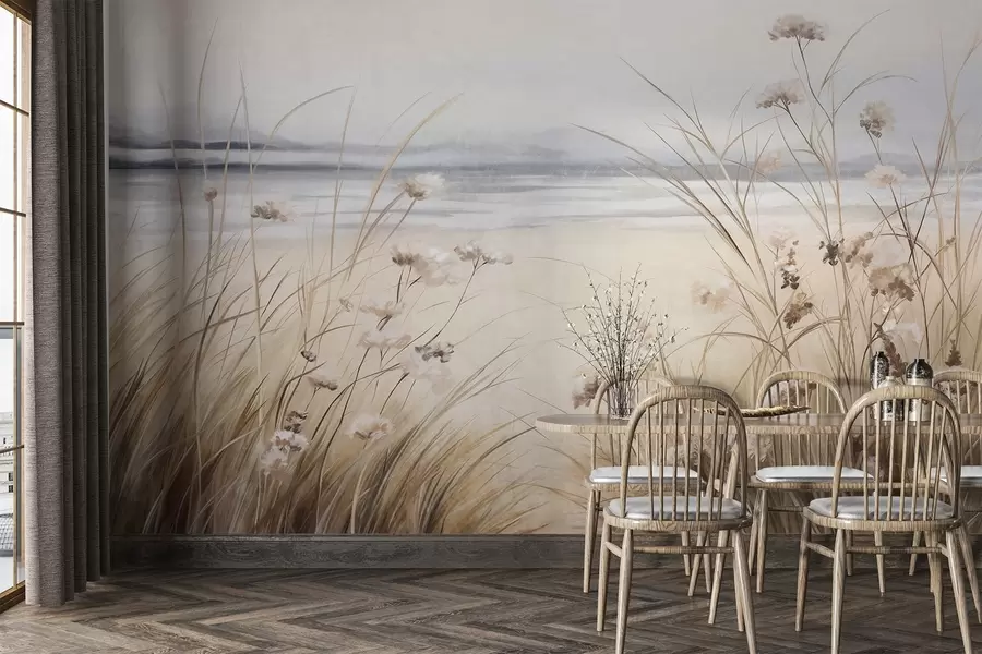 Papier peint photo Un champ de blé avec des fleurs blanches au premier plan, une plage et l'océan à l'arrière-plan, des couleurs neutres et pastel w09298