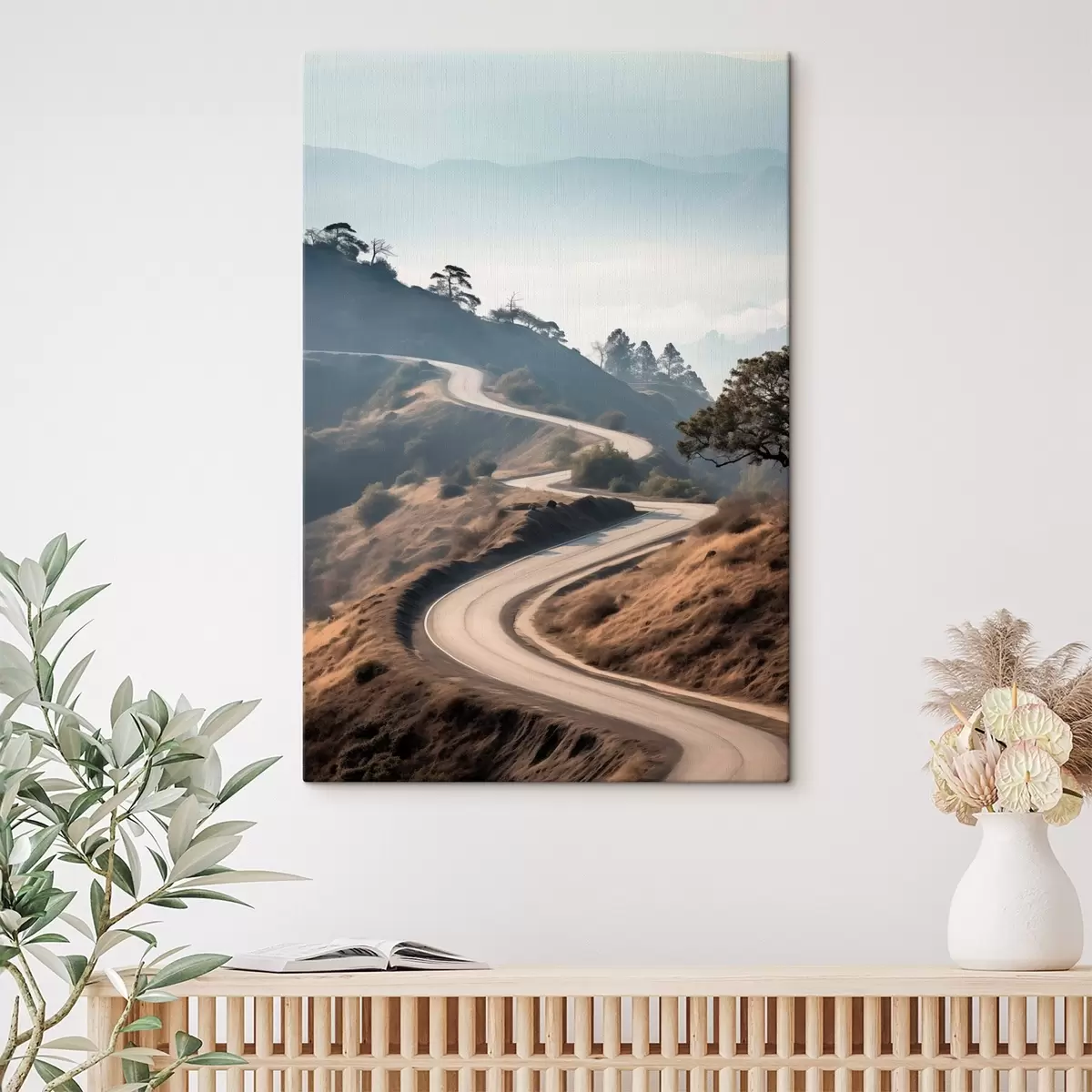  Peintures Une route sinueuse à travers un paysage vallonné recouvert d'herbe sèche, sous un ciel clair, avec des montagnes au loin s46289