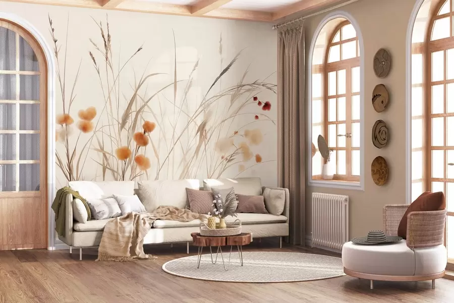 Fotobehang Hoog gras en kleine oranje wilde bloemen tegen een bleke achtergrond, in een boho-stijl met veel textuur w09902